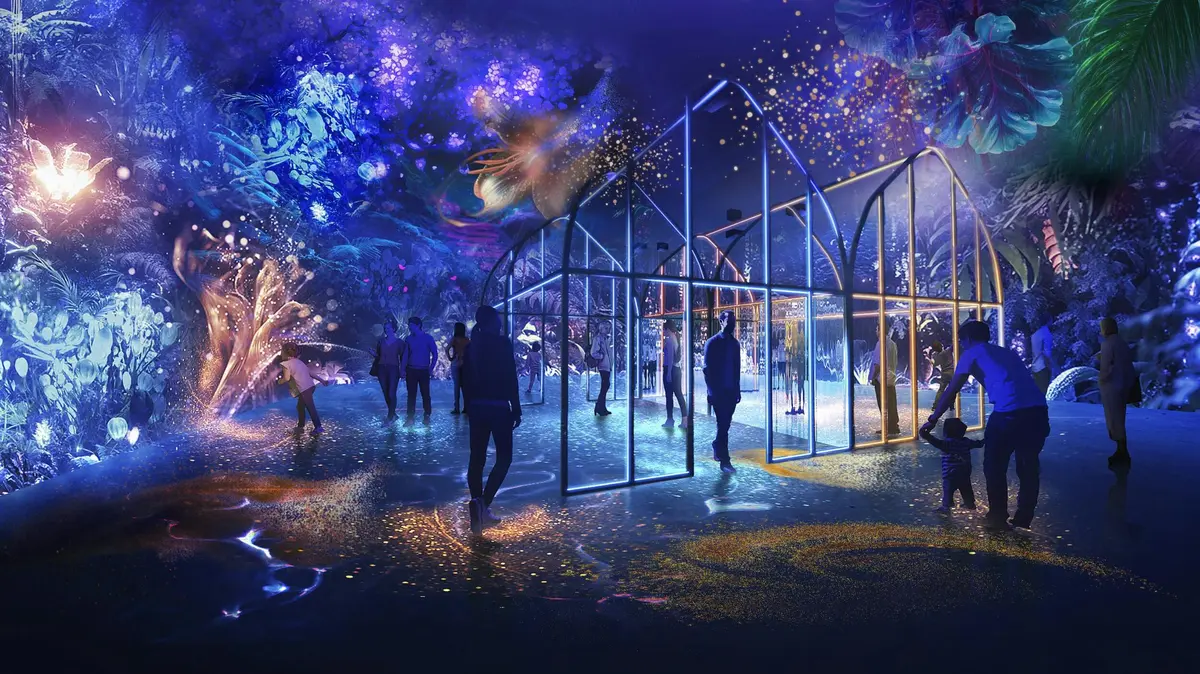 Une exposition colorée et illuminée avec des structures lumineuses, des personnes qui explorent et des images sous-marines vibrantes.
