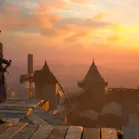 Une personne munie d'une épée se tient sur une plate-forme en bois surplombant un village de style médiéval au coucher du soleil, avec des tours en pierre et un moulin à vent. &copy; Carcassonne