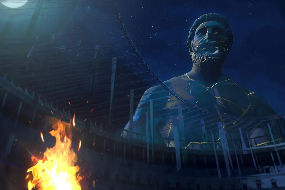 Une grande statue représentant un homme barbu, baignée d'une lumière bleue, avec un feu et la structure d'un stade au premier plan, dans un décor nocturne.