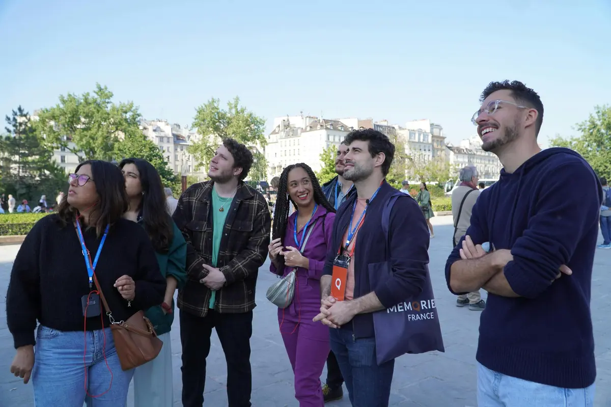 Small group and guide in front of Notre Dame Cathedral