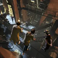 Trois personnes portant des casques de RV se tiennent sur une passerelle métallique surplombant un intérieur industriel à plusieurs niveaux. &copy; TITANIC