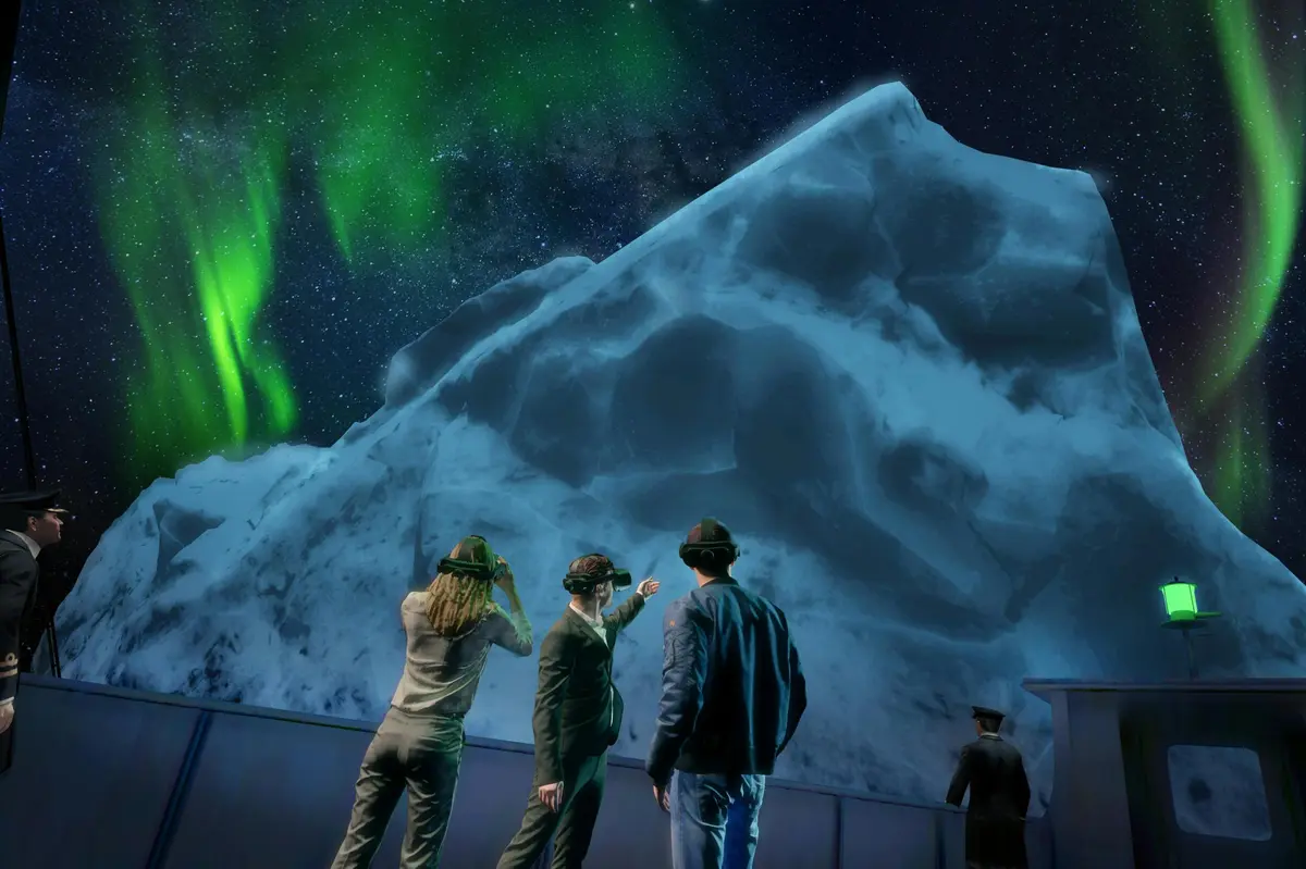 Un groupe de personnes observant les aurores boréales au-dessus d'une grande montagne glacée, dans un ciel nocturne étoilé.