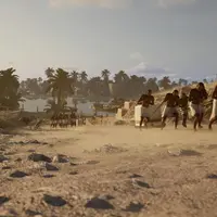 Des hommes en pagne tirent une lourde charge sur un chemin poussiéreux avec des palmiers et une rivière en arrière-plan. &copy; TDB