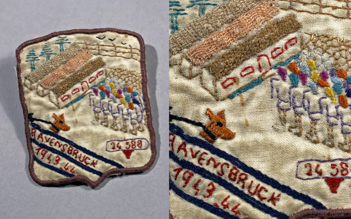 L'écusson fabriqué au camp de Ravensbrück, par Marguerite Flamencourt, résistante française, offert à Germaine Tillion, dont le numéro de matricule est brodé en bas à droite de l'objet. Aujourd'hui conservé au Musée de la Résistance et de la Déportation de Besançon