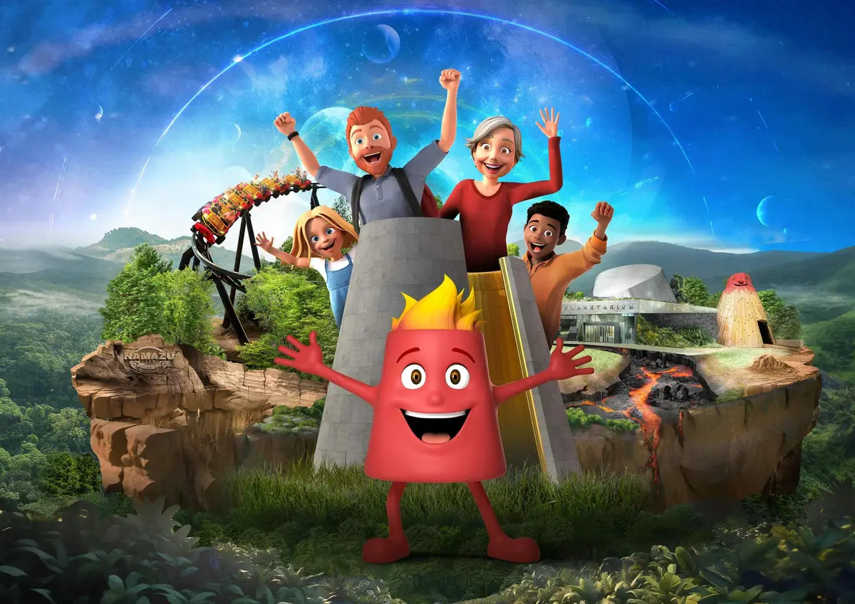 Personnages animés applaudissant les mains levées, montagnes russes et volcan en arrière-plan sous un ciel étoilé.